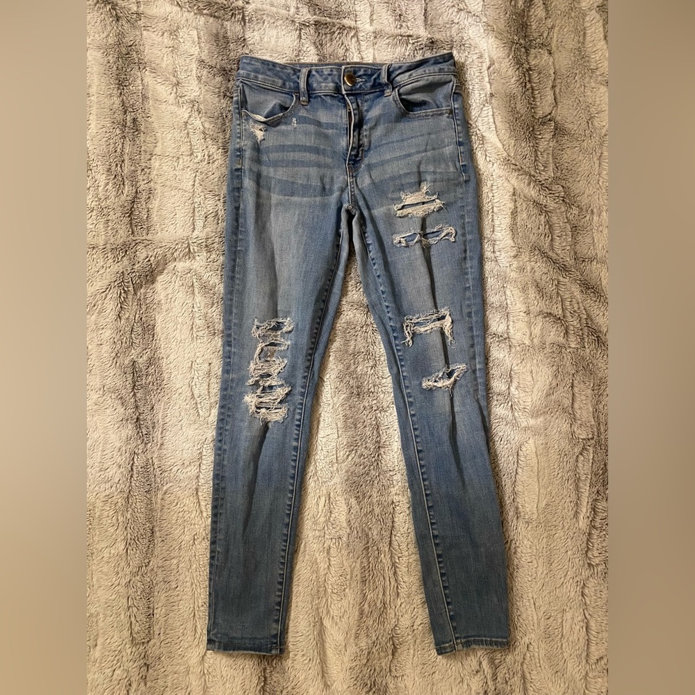 American Eagle | High Rise Super Stretch Skinny Distressed Light Blue Jeans - Picture 1 of 7